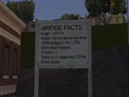 A visitor center sign containing facts about the Gant Bridge.