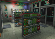 Shelves stacked with bottles and other stuff in 24/7 convenience store.