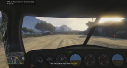 Trevor landing at the airfield.