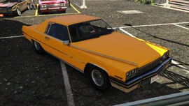 The buyer's yellow Manana. (Rear quarter view)
