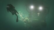 Trevor following Michael in scuba diving gear in a Submersible.