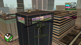 Victor circles the building while shooting at Mendez Cartel's guards.
