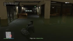 Plug in the malware drive and hack the terminal to help Jodi access the data.