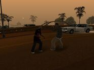 A Hispanic Los Santos criminal (right) fighting with a woman.