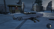 The snow variant of the Emperor. It likely belongs to Alex, as it is parked beside the security booth where he was shot dead.