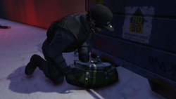 Collecting the weapon stash previously hidden by the player.