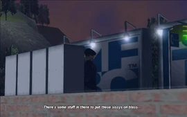 D-Ice informs Claude that he has left some equipment nearby that Claude could use to blow up said vans.