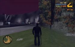 After picking the rifle up, Claude prepares to use it to clear out the gangsters guarding the checkpoint.