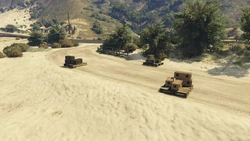 AssaultonATT16-GTAOe-DefenderLoadoutCrates2.png (4.35 MB) Defender loadout crates after the opposing team takes out the first two terminals, on a dirt path on the other side of the motorway.