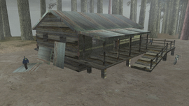 The cabin containing The Informant on Mount Chiliad with an FBI agent patrolling the outside of the cabin.