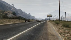 Looking along Route 15 as it nears the intersection with Senora Way and the Senora Desert.