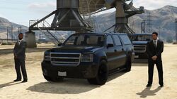 FIB agents spawning at the station in the original version of GTA V, next to one or two FIB Buffaloes or FIB Grangers parked up.