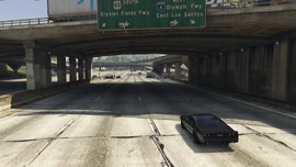 Passing underneath Elgin Avenue and reaching the finish line.