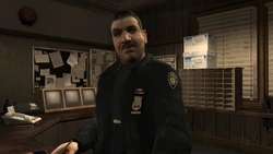 MitchTheCop-GTAIV-WestminsterPoliceStation.png (1.11 MB) Mitch as he appears in Final Interview.