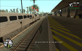 Smoke tells CJ to drive fairly close to the train so he can get a clear shot.