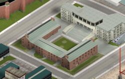 Pre-release aerial view of the Liberty City Community College. The center campus building is significantly different from that of the final game, as the lead image illustrates.