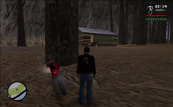 Carl stalking the target in the cabin from the woods nearby.