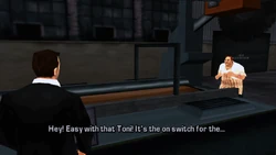 Casa notices Toni going to a control panel and tells him to be careful not to turn on the wood grinder machine.