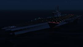 Front quarter of the ship at night.