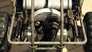 Two oval-shaped filters seen next to the engine, on the Dune Buggy.