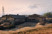 ElBurroHeights-GTAO-VehicleWarehouseExterior.png