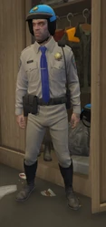 Trevor Philips wearing the cop outfit in Grand Theft Auto V.