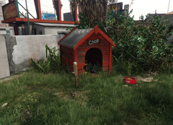 Chop's doghouse in the backyard at the Clinton Residence.