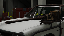 Close-up of the mounted .50 Cal (rusted, left)