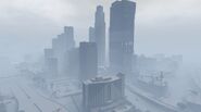 Downtown Los Santos skyline during snowfall.