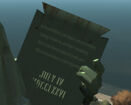 The statue's tablet, complete with the humorous inscription, GTA IV.