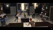 The gunmen burst into Vangelico and threaten hostages with weapons.