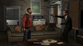 Tony threatens Luis with a Pistol.