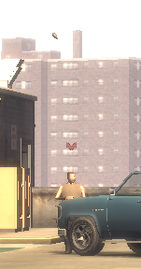 Keenan throwing a grenade at Niko Bellic.