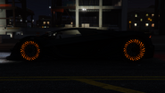 The Tezeract's wheels glowing at night.