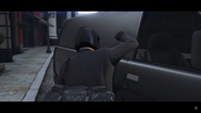 A gunman gets out and bangs on the side of the van.