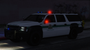 A Park Ranger with lights and sirens activated. (Rear quarter view)