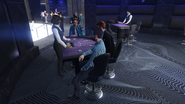 Playing three card poker at the high roller tables.