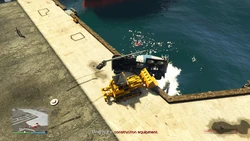 Pushing the construction equipment into the ocean