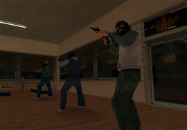 Three gangsters robbing the King Knuts during the mission.