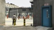 Prison guard overlooking the prisoners in the yard