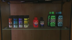 Motion Lotion and U Lube It products on a shelf.