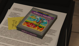 Monkey's Paradise cartridge box on the desk in the Arcade Office.