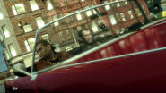 Pre-release screenshot of Niko Bellic and Little Jacob driving a Peyote.
