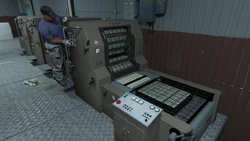 Staff operating the press (stopping a jam).
