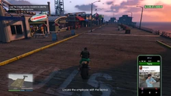 Use the image provided sent by Vincent to identify the Cluckin' Bell employee