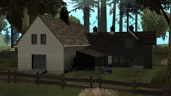 Rear view of the farmhouse during the day.