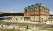 LaPuerta-GTAO-VehicleWarehouseExterior.png