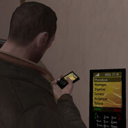 The mobile phone interface in GTA IV is rendered as a sprite in the lower-right of the screen; the sprite is mapped onto the front of the phone model itself, as seen here.