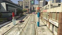 The route turns right onto , with two blue pillars