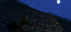 Throwing a grappling hook over a wall.